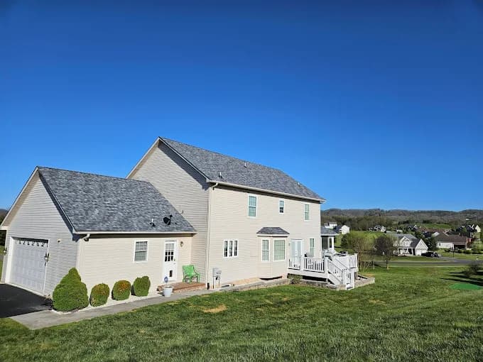 Two-story home with a gray asphalt shingle roof