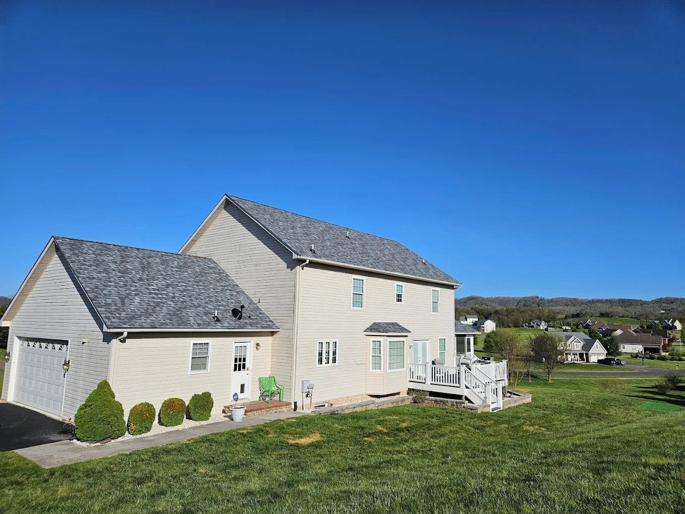 Two-story home with a new gray architectural shingle roof
